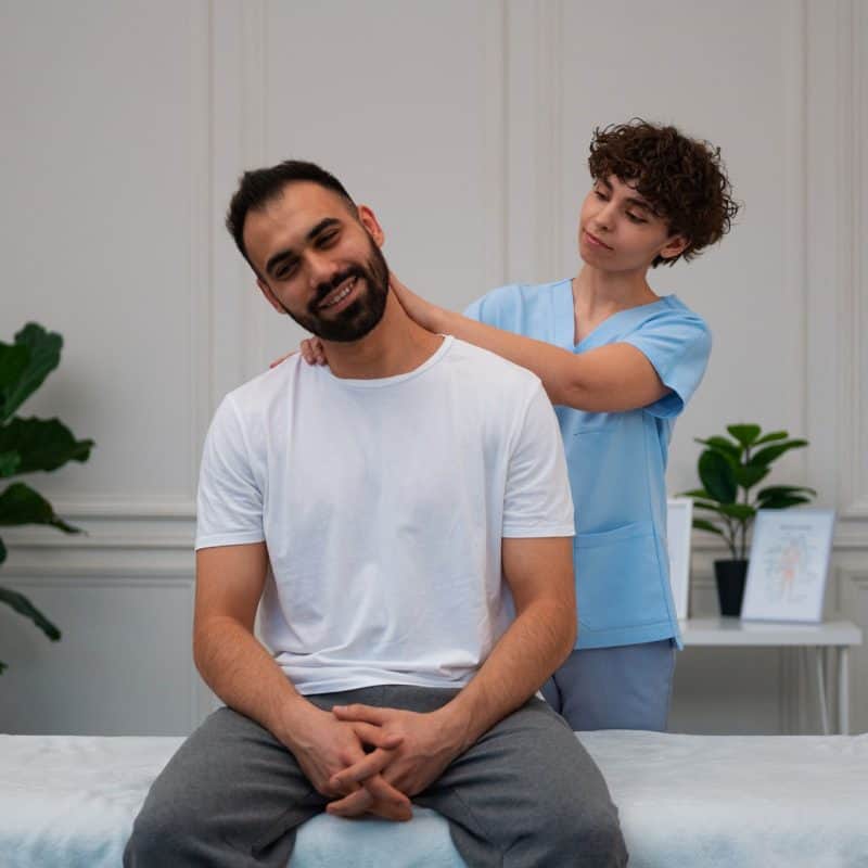 Assistive stretching of a patient's neck.