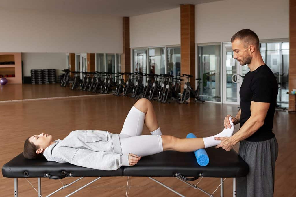 Physical therapist assisting patient with rehabilitation exercises at Eatontown Elite Care Center in Monmouth County, NJ